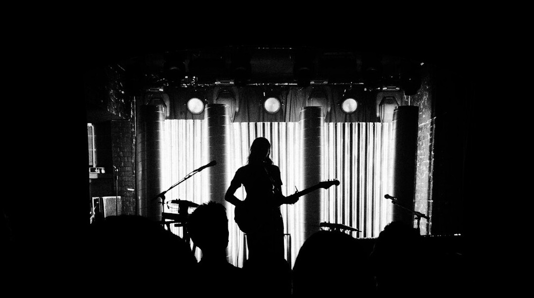 Musician silhouette performing on stage