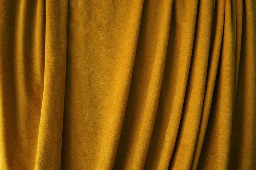 Golden velvet curtain with soft light